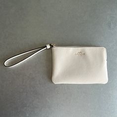 Coach White Wristlet Wallet, New With Tags Inside! Chic On-the-go Wristlet Clutch, Everyday Coin Purse Clutch With Wrist Strap, Everyday Coin Purse With Wrist Strap, Classic Everyday Bag With Wrist Strap, Classic Everyday Bags With Wrist Strap, Classic Everyday Clutch With Wrist Strap, Chic Wristlet With Zipper Pouch, Chic Zipper Pouch Wristlet, Classic Everyday Coach Coin Purse