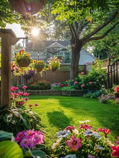 the sun shines brightly through the trees and flowers in this backyard garden with lush green grass