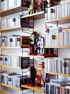 the shelves are filled with many different types of cd's