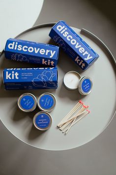 an assortment of toothpaste and toothbrushes on a plate