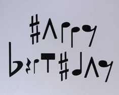 a piece of paper with the words happy birthday written in black and white on it