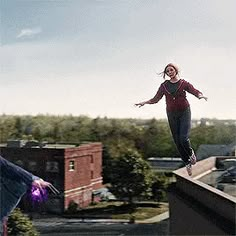 two people jumping in the air on skateboards