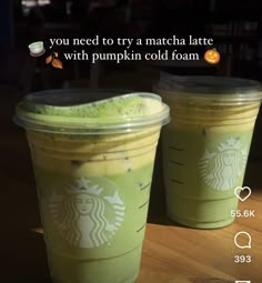 two starbucks drinks sitting on top of a wooden table next to each other with the caption you need to try a matcha latte with pumpkin cold foam