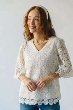 Introducing The Passey Crochet Blouse in Oatmeal! This unique top features a delicate crochet design and a cozy oatmeal color. Perfect for those who want to add a touch of charm and texture to their wardrobe. Embrace your playful and quirky side with this must-have piece. Details self/lining: 100% polyester Fabric Care Guide Here Sizing & Fit Measurements are approximate and taken while laying flat across the front. Not doubled. small: bust = 20"; length = 26" medium: bust = 21"; length = 26" la Feminine Beige Tops With Lace Sleeves, Feminine Beige Top With Lace Sleeves, Elegant Lace Crochet V-neck Top, Cream V-neck Top With Crochet Trim, Elegant Crochet V-neck Top With Lace Trim, Elegant Cream Crochet Top For Spring, Feminine Crochet V-neck Top With Lace Trim, Feminine Crochet Top With Lace Trim And V-neck, Feminine Crochet Lace Top