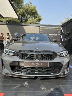 the new bmw m4 is displayed at an auto show