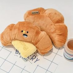 a stuffed animal next to a roll of tape