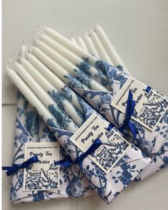 blue and white candles with tags on them