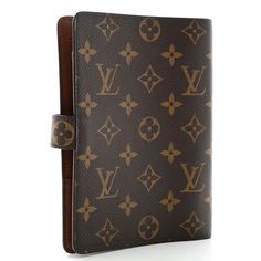 This is an authentic LOUIS VUITTON Monogram Medium Ring Agenda Cover. This classic agenda is crafted of Louis Vuitton monogram coated canvas. It features a folder style structure and a cross over polished gold snap closure. This opens to a terra cotta cross-grain leather interior with card slots, patch pockets, pen loop, and brass rings for inserts. Agenda Cover, Brass Rings, Brass Ring, Terra Cotta, Leather Interior, Authentic Louis Vuitton, Louis Vuitton Monogram, Snap Closure, Patch Pocket