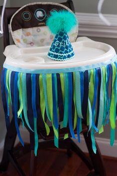 a small table with a blue and green hat on it