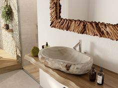 a bathroom sink sitting on top of a wooden counter