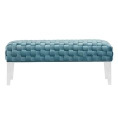 a blue bench with white legs and an upholstered design on the backrest