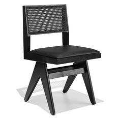 a black chair sitting on top of a white floor next to a wooden frame and seat