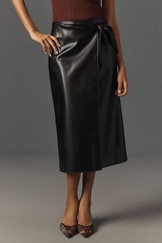 The PAIGE Odgen Skirt is crafted from soft stretch faux leather and features a fully functional wrap silhouette, draped details, and a tie at the side. | Ogden Faux-Leather Midi Skirt by PAIGE in Black, Women's, Size: 8, Leather/Polyurethane at Anthropologie Faux Leather Midi Skirt, Leather Midi Skirt, Timeless Wardrobe Staples, 50 Fashion, Guest Dresses, Lifestyle Brands, Wardrobe Staples, Midi Skirt, Anthropologie