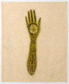 a drawing of a hand with leaves on it's palm and the middle part of its body painted yellow