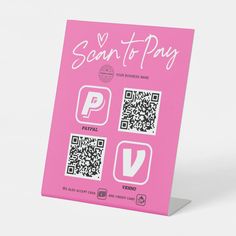 a pink sign with qr code on it that says scan - to - pay