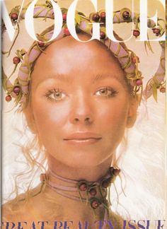 a magazine cover with a woman wearing a headdress on the front and side