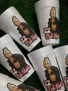 six white cups with pictures of the same woman on them