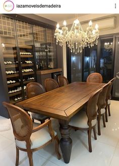 a large wooden table surrounded by chairs in a room