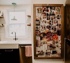 a kitchen with pictures on the wall and a dishwasher