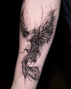 a black and white tattoo with an eagle on the arm, done by a woman