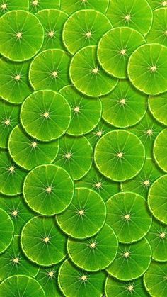 a green background with lots of leaves in the shape of waterlily circles on top of each other