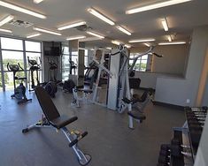 an empty gym with many exercise machines