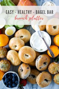 an assortment of bagels and fruit on a marble counter top with the words easy healthy - bagel bar brunch platter