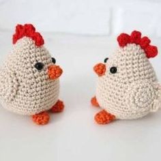 two crocheted chickens sitting next to each other