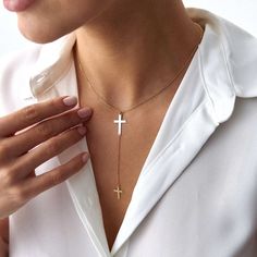 Elevate your style with our stunning cross lariat necklace, crafted from 14k solid gold. This elegant piece features a minimalist design with a symbolic double cross, embodying both grace and meaning. Perfect for layering or as a standout piece. Our necklace is crafted with real 14k solid gold (not plated, not vermeil, not gold filled) You don't need to worry about water, perfume or conditioner contact since real gold keeps its beauty for a lifetime. Drop length: 1. 25 Inches / 32. 0 mm Elegant Crucifix Cross Necklace, Elegant Cross Necklace With Adjustable Chain, Minimalist Crucifix Cross Necklace With Clavicle Chain, Elegant Cross Pendant Lariat Necklace With Adjustable Chain, Elegant Cross Lariat Necklace With Adjustable Chain, Elegant Cross-shaped Lariat Necklace With Adjustable Chain, Elegant Cross Lariat Necklace, Elegant Gold Lariat Necklace With Cross, Elegant Gold Cross Lariat Necklace