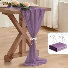 the table is covered with purple cloths and flowers