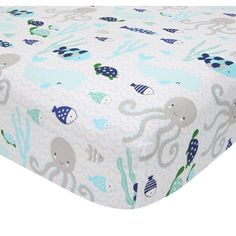 an image of a baby crib sheet with animals on it