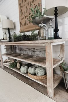 a shelf with some plants on top of it