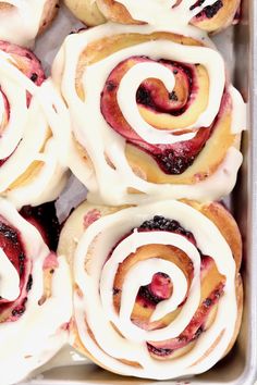 several pastries with white icing in a pan