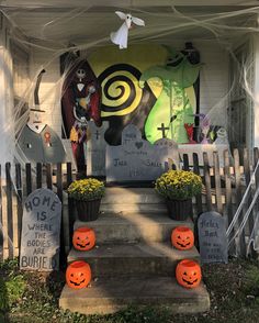 halloween decorations on the front steps of a house