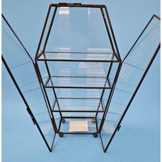 a glass display case sitting on top of a blue floor