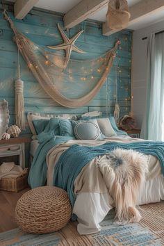 a bedroom decorated in blue and white with a hammock hanging above the bed