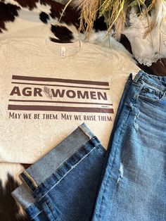 Embark on a stylish journey with the Agriwomen tee from Big Country's Western Wear. This tee is not just a piece of clothing; it's a statement for those who cherish agriculture and want to support women in the industry. Ideal for any farming enthusiast, this tee ensures you can harvest your style while promoting a crucial cause. Don't miss out on this playful and significant addition to your wardrobe. Western Women Tshirts, Agriculture Tattoos For Women, Farming Outfit Women, Ffa Shirts Designs, Farming Aesthetic, Agro Tourism, Ag Teacher, Farm Clothes, Support Women