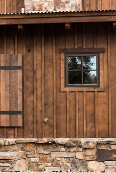 the side of a wooden building with a window