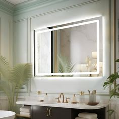 a bathroom with a large mirror above the sink and a tub in front of it