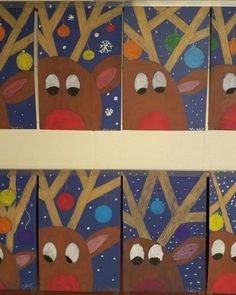 four paintings of reindeers are hanging on the wall