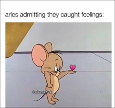 a cartoon mouse holding a pink heart with the caption aris admitting they caught feelings