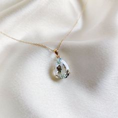 This stunning pendant is set in 14K Solid Yellow Gold with Natural Aquamarine with utmost precision. It is an unique gemstone pendant for nearly every occasion and is completely hassle-free jewelry. ITEM DETAILS * Gem: Aquamarine * Gem Size: 10X15mm * Gem Shape:  Pear CUT * Gem Weight: 5.64 carats * Gold Purity: 14KT  * Gold Weight: 0.99 gram * Total Weight of the Pendant: 2.12 gram The Gold purity is guaranteed and it comes with authentic 14KT gold hallmark. Since my items are handmade, they are absolutely nickel and lead free. CUSTOMIZATION * Gemstone customization is available and it can be substituted with a gem of your choice. Kindly message me for the same. PACKAGING * The Pendant comes with layers of safe and secure wrapping along with Free handmade jewelry box with every purchase. Fine Jewelry Aquamarine Pendant, Aquamarine Necklace Pendant, Gold Aquamarine Pendant Necklace, Yellow Gold Aquamarine Pendant Jewelry, Aquamarine Gemstone Necklace For Gifts, Ethereal Jewelry, Handmade Jewelry Box, Aquamarine Pendant, Aquamarine Necklace