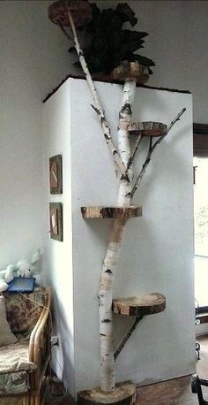 a living room with a tree shaped shelf in the corner