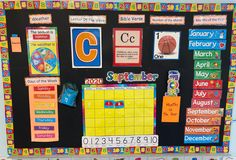 a bulletin board with lots of magnets and numbers on it's front wall