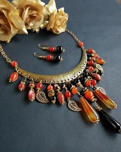 "Designer handmade brown pendant autumn set in boho style,customized necklace and earrings with natural stones Carnelian, agate,gold plated fittings, gift for her \"Autumn Rhapsody\" Hot necklaces in warm autumn colors are already ready to dance with you in front of the bright leaves🍂 Add bright autumn colors to your look👌  The ideal combination of bright colors, natural precious stones (carnelian, agate, facing accessories) will create a bright accent in your image!👌 📐Necklace length: 45 cm 📐Earring length: 4 сm 🎁 Gift box" Bohemian Agate Earrings, Bohemian Brown Carnelian Jewelry, Handmade Bohemian Carnelian Earrings, Hot Necklaces, Bright Autumn, Customized Necklace, Handmade Boho Jewelry, Carnelian Agate, Carnelian Jewelry