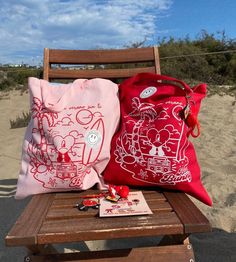 "Shop our one of a kind UVST Shoulder Beach Tote Bags are made of 100% Heavy Cotton Canvas Un Verano Sin Ti tote bag details: - 9 inch handle drop, comfortably fits over shoulder (20\" web canvas handles) - heavy weight tote bag and can carry at least 8 lbs - dimensions: 14.5 in x 15.5 inch - available in two colors: original pink w/ red print red tote w/ white print *Keychains sold separately  - Lovingly design by ShopHappyVibras" Pink Backpack For Vacation, Summer Pouch Bag As Gift, Fun Handmade Travel Bag, Red Summer Beach Bag Gift, Red Summer Bag For Everyday, Summer Red Everyday Bags, Eco-friendly Pink Canvas Beach Bag, Eco-friendly Pink Bags For Beach Season, Eco-friendly Pink Bag For Beach Season