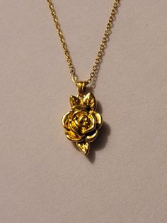 Gold Rose Cremation Urn Necklace comes on a 20 inch gold stainless steel chain.  ** This necklace is also available in silver. We provide you with everything needed to help you get the ashes into the urn.  Both urn and chain are stainless steel.  If you would like to personalize this necklace,  please go to our "ADD ON" section.  There you will find birthstones, initials and much more that you could add to this bracelet to personalize it. Please feel free to message us with any questions you may have.  Thank you so much! Gold Necklaces With Roses For Anniversary, Gold Jewelry With Roses For Gift, Gold Roses Jewelry For Gift, Gold Roses Jewelry For Anniversary, Gold Rose Jewelry For Anniversary, Gold Necklaces With Roses For Gift, Gold Jewelry With Rose Flower Pendant, Gold Jewelry With Rose Details As Flower Pendant, Gold Necklaces With Rose Flower Pendant