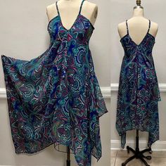 "Adjustable straps Hanky hem dress in a beautiful paisley print. V-neck Flowy This dress will fit a size M-L Center front length from strap joint 37\" Length from start joint to longest point 50\" Sweep 112\" Bust 34\"" Sleeveless Patterned Paisley Print Maxi Dress, Sleeveless Patterned Maxi Dress With Paisley Print, V-neck Beach Sundress With Paisley Print, V-neck Paisley Print Beach Sundress, Beach Sundress With V-neck And Paisley Print, Assymetric Dress, Hanky Hem, Paisley Print Dress, Dip Dye