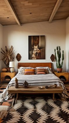 a bed sitting under a painting on top of a wooden headboard in a bedroom