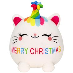 a white stuffed cat with a party hat on its head and the words merry christmas